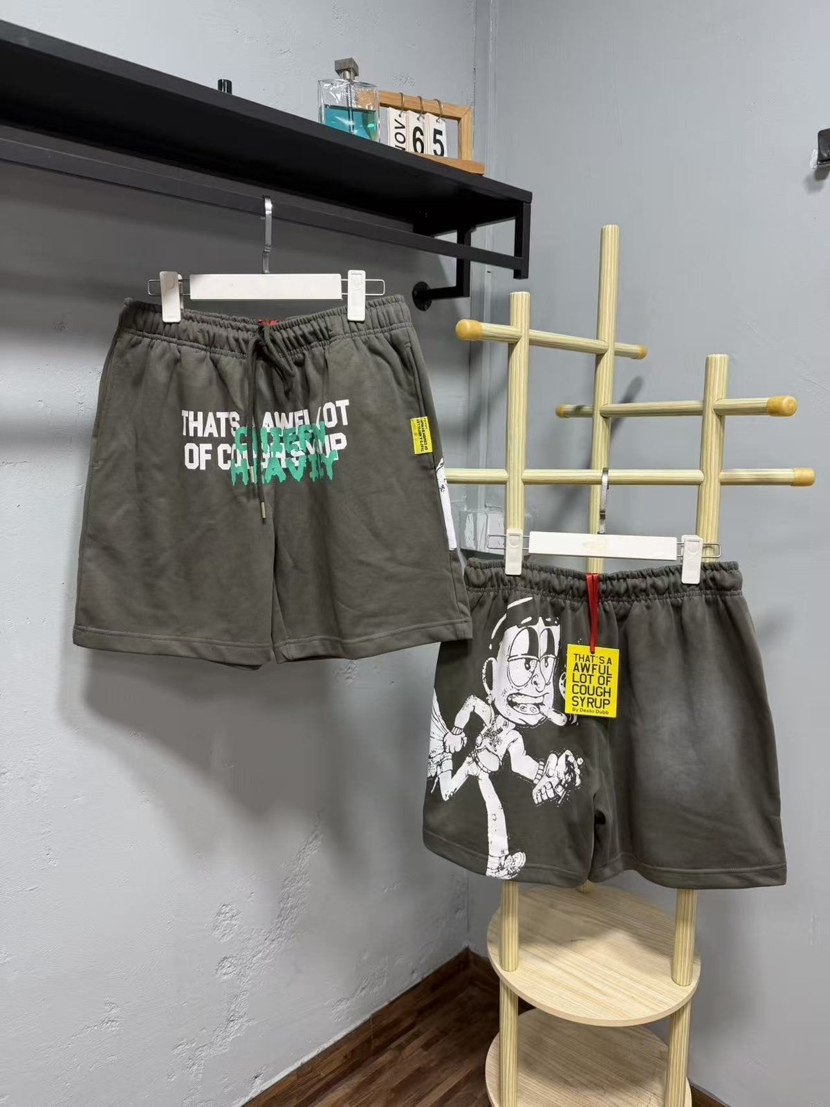 THAT'S A AWFUL LOT OF COUGH SYRUP Cartoon Back Graphic Shorts ¡ª front